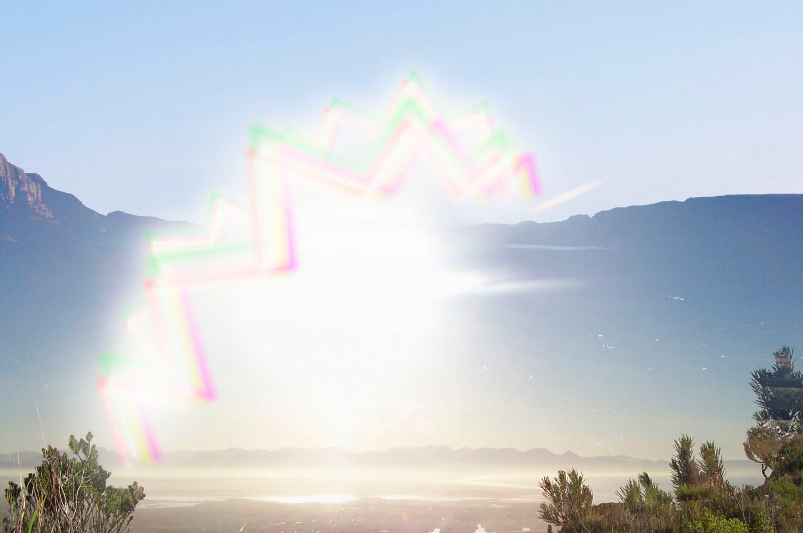 A bright zigzag pattern across a landscape view, showing the visual disturbance of a migraine aura.